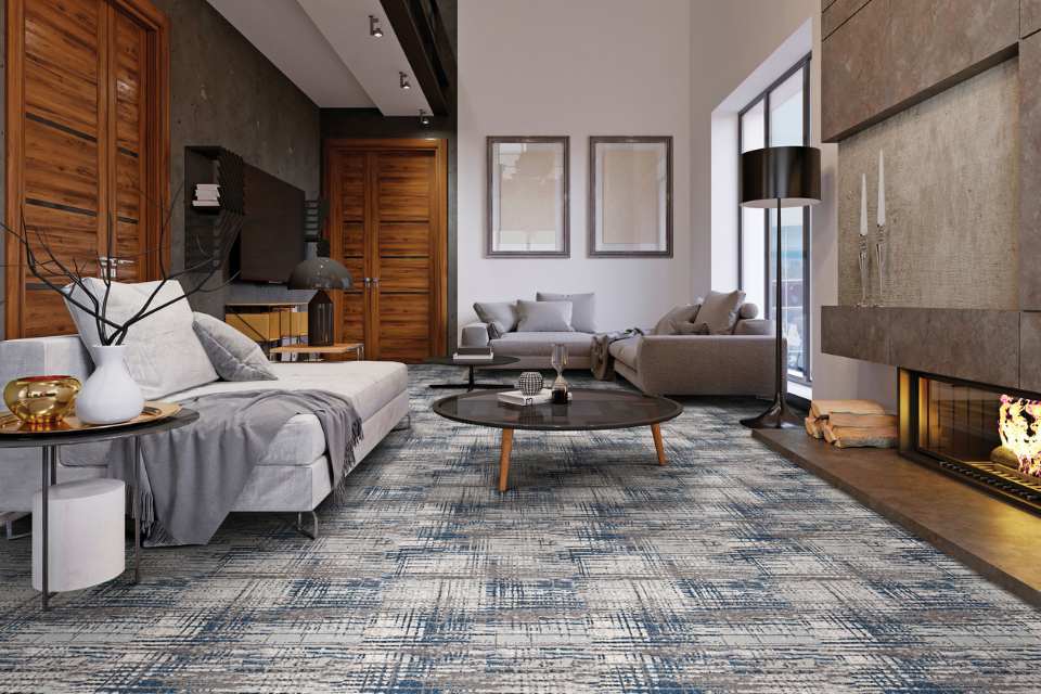 patterned carpet in retro living room with grey tones and wood accent paneling
